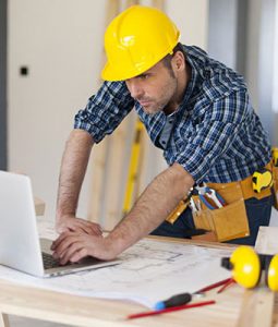 Construction worker on laptop